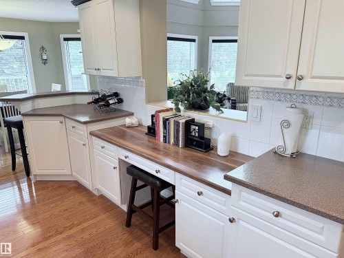 Custom built-in desk area featuring wood-finish countertop - 915 Picard Drive Nw, Edmonton, AB 