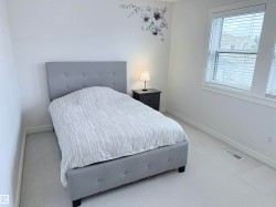 Room featuring neutral-toned carpeting and white wall finishes - 