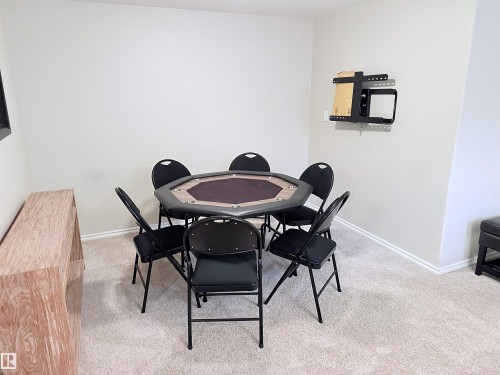 Carpeted room featuring light-toned walls and white trim - 915 Picard Drive Nw, Edmonton, AB 