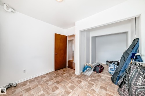 Neutral-toned tile flooring throughout - 6804 102A Avenue, Edmonton, AB 