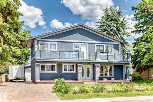 Two-story residence featuring a stucco exterior with stone-clad columns - 6804 102A Avenue, Edmonton, AB 