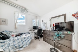 White walls and light-colored carpeting create a bright interior - 
