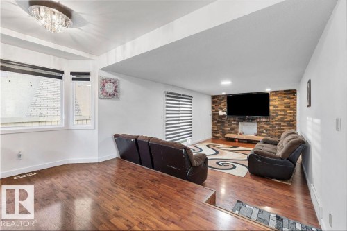 Multi-level living area featuring rich wood-finish flooring - 712 Lee Ridge Road, Edmonton, AB 