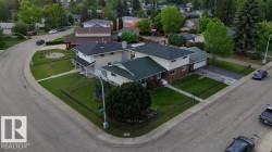 Corner lot property featuring a multi-level design with a double garage - 