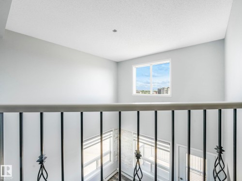 Upper-level space featuring a single window and recessed lighting - 2406 320 Clareview Station Drive, Edmonton, AB 