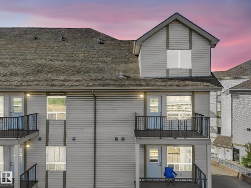 Multi-story exterior with horizontal siding and a gabled dormer - 2406 320 Clareview Station Drive, Edmonton, AB 