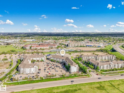 Aerial perspective showcasing multi-story residential buildings with surface parking - 2406 320 Clareview Station Drive, Edmonton, AB 