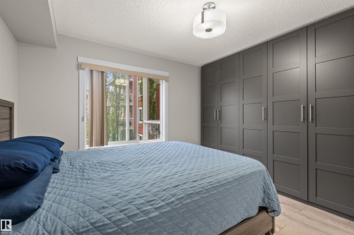 Full-height built-in wardrobe with panel doors and brushed nickel hardware - 210 2229 44 Avenue, Edmonton, AB 