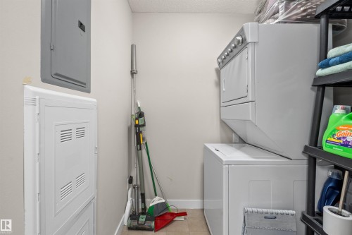 Dedicated laundry area featuring a stacked washer and dryer - 210 2229 44 Avenue, Edmonton, AB 