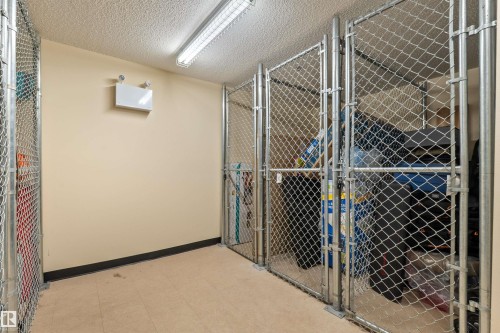 Dedicated storage units featuring chain-link construction and secure latching mechanisms - 210 2229 44 Avenue, Edmonton, AB 