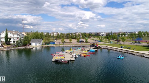 Waterfront property featuring a private dock, boat launch, and direct access to the lake - 46 4050 Savaryn Drive, Edmonton, AB 