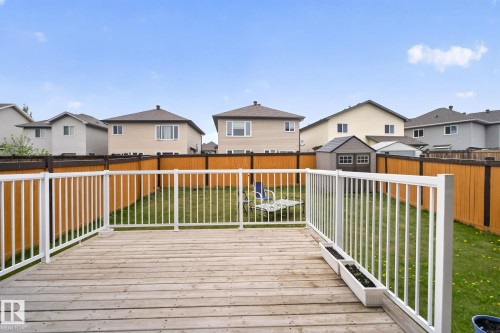 Expansive wooden deck with white railings - 3350 18B Street, Edmonton, AB 