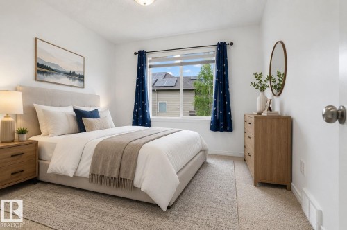 Bright interior with light-colored carpeting and white walls - 3806 Powell Wynd, Edmonton, AB 