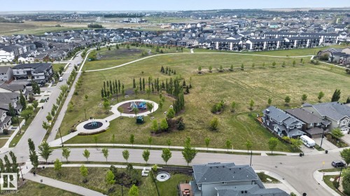 Expansive park area featuring established green spaces, walking paths, and two distinct play structures - 3806 Powell Wynd, Edmonton, AB 