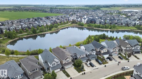 Aerial perspective showcasing a residential area with a prominent body of water - 3806 Powell Wynd, Edmonton, AB 