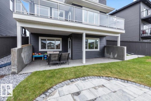 Lower-level patio area featuring a concrete surface and direct access to the back exterior - 45 Elwyck Gate, Spruce Grove, AB 