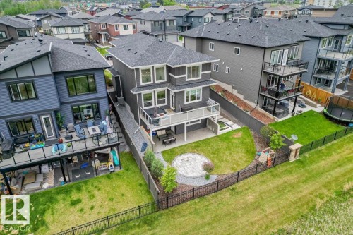 Contemporary multi-level home with a spacious backyard featuring a circular stone patio - 45 Elwyck Gate, Spruce Grove, AB 