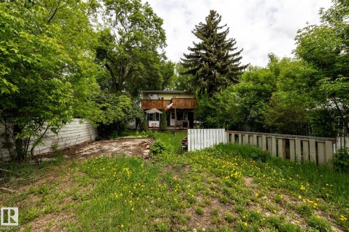 Rear yard with concrete pad and perimeter fencing - 5919 121 Avenue, Edmonton, AB 