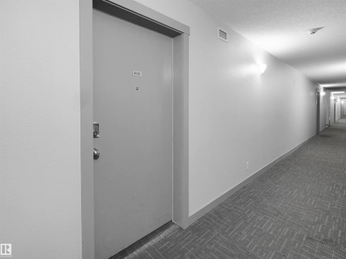 Entry door with contemporary hardware - 406 11820 22 Avenue, Edmonton, AB 
