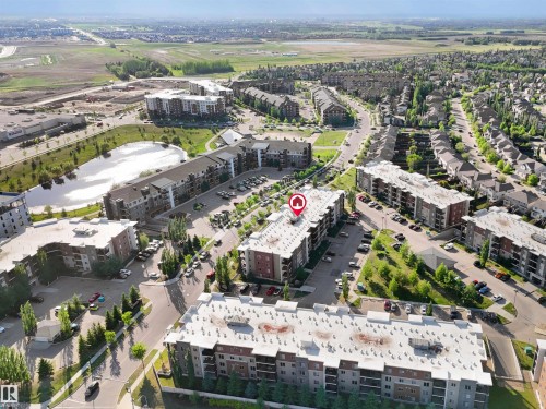 Aerial perspective showcasing a multi-unit residential building within a developed community - 406 11820 22 Avenue, Edmonton, AB 