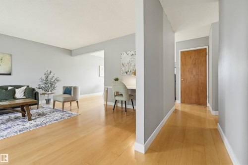 Hardwood-style flooring throughout living areas - 10712 52 Avenue, Edmonton, AB 