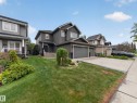 Two-story residence featuring a two-car garage with a concrete driveway - 5608 Soleil Boulevard, Beaumont, AB 