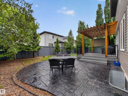 Expansive stamped concrete patio with decorative border - 5608 Soleil Boulevard, Beaumont, AB 
