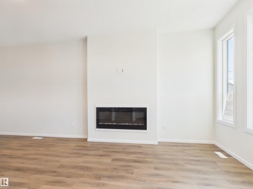 87 Sereno Lane, Fort Saskatchewan, AB - Indoor Photo Showing Other Room With Fireplace