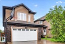 Two-story stucco residence with a prominent attached garage - 1326 Cunningham Drive, Edmonton, AB 