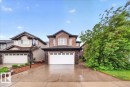 Contemporary two-story residence featuring a stucco and stone facade - 1326 Cunningham Drive, Edmonton, AB 
