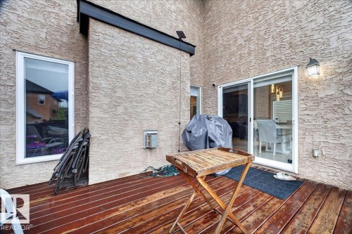 Outdoor wood-finish deck with stucco exterior - 1326 Cunningham Drive, Edmonton, AB 