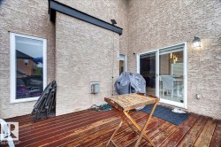 Outdoor wood-finish deck with stucco exterior - 