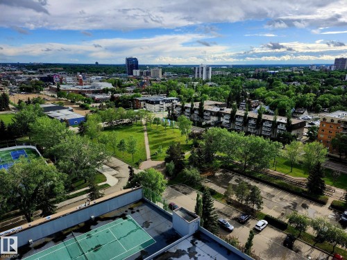 Elevated perspective showcasing a broad urban landscape with varied architecture and extensive greenery - 1600 10149 Saskatchewan Drive, Edmonton, AB 