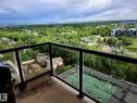 Private balcony with glass panel railing and cityscape backdrop - 1600 10149 Saskatchewan Drive, Edmonton, AB 
