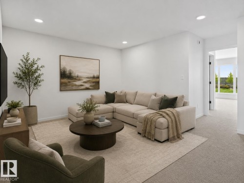 Carpeted living area featuring recessed lighting, a neutral color palette, and a doorway opening to additional interior space with exterior views - 8108 230 Street, Edmonton, AB 