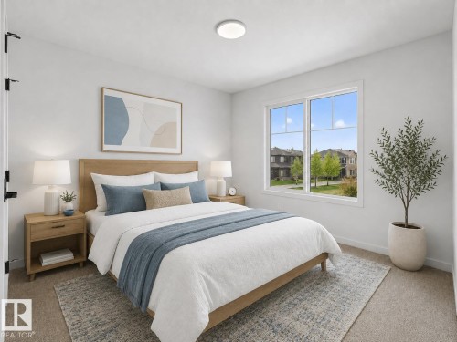 Carpeted bedroom featuring a large window, a ceiling-mounted light fixture, and a neutral wall color - 8108 230 Street, Edmonton, AB 