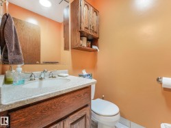 Vanity with a light-toned countertop, integrated sink, and chrome faucet - 