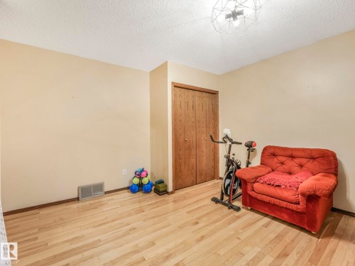 Room featuring light wood-finish flooring and a neutral wall color - 11921 231 Street, Edmonton, AB 