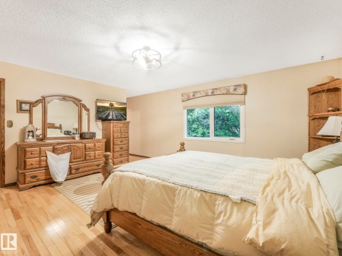 Interior room featuring light-toned walls and wood-finish flooring - 11921 231 Street, Edmonton, AB 