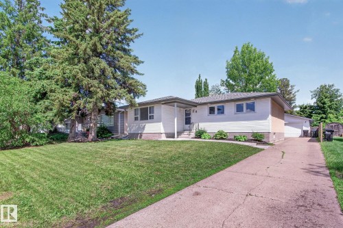 Ranch-style residence featuring white siding, a covered front entry, and a side-attached garage - 3 Galaxy Way, Sherwood Park, AB 