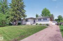 Ranch-style residence featuring white siding, a covered front entry, and a side-attached garage - 3 Galaxy Way, Sherwood Park, AB 