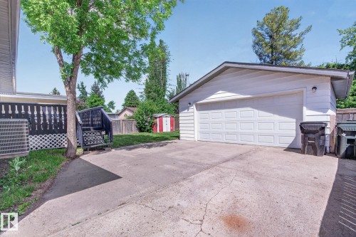 Detached garage with white panel siding and a concrete driveway - 3 Galaxy Way, Sherwood Park, AB 