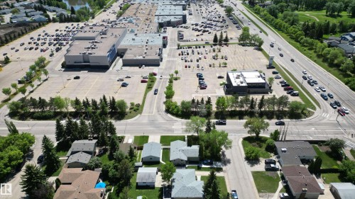 Aerial perspective highlighting multiple residential properties with pitched roofs and surrounding green spaces - 3 Galaxy Way, Sherwood Park, AB 