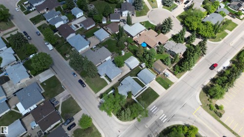 Aerial perspective showcasing residential properties with mature trees, green lawns, and paved streets - 3 Galaxy Way, Sherwood Park, AB 