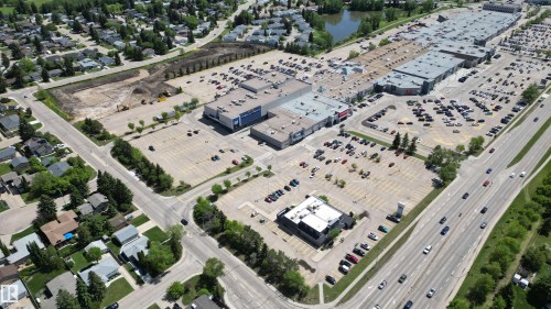 Aerial perspective showcasing a commercial development with extensive parking areas and multiple retail buildings - 3 Galaxy Way, Sherwood Park, AB 