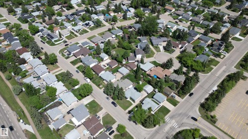 Residential neighborhood featuring detached homes with varied architectural styles, mature trees, paved streets, and a circular cul-de-sac - 3 Galaxy Way, Sherwood Park, AB 