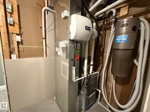 HVAC system featuring a humidifier and central vacuum system with accompanying hoses - 2 104 Allard Link, Edmonton, AB 