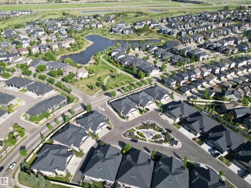 Aerial perspective showcasing a residential community with varied architectural styles - 2 104 Allard Link, Edmonton, AB 