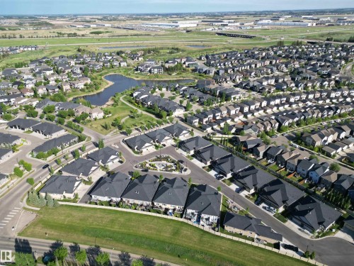 Aerial perspective showcasing a residential community with diverse housing styles - 2 104 Allard Link, Edmonton, AB 