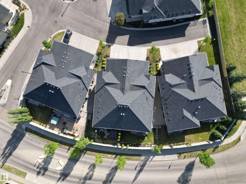 Gable roofline with dark shingles - 2 104 Allard Link, Edmonton, AB 
